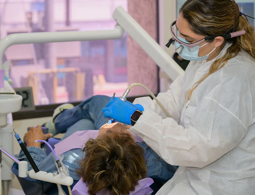 Dental team caring for an adult patient at Orthodontics in Woodland Hills